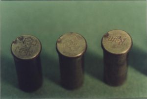 Photograph of the left 3 cases. The double firing pin strike supports Mr. Waller’s, and witnesses, testimony that a warning shot was fired and, after a paause, the revolver was fired until ammunition expended.