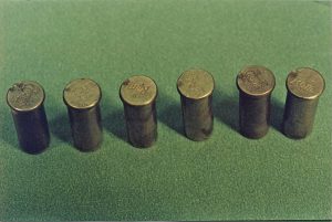 Photograph of the 6 cartridge cases recovered from Mr. Waller’s revolver. Note the double firing pin strike on the left most case.